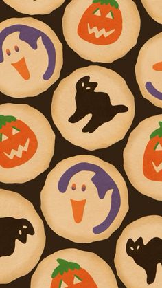 halloween cookies with faces and pumpkins on them are arranged in the shape of circles