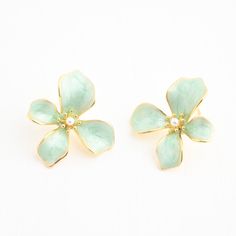 Our Hope In Bloom Earrings make an unforgettable statement you’ll want to pair with every look! Stunning mint enamel on 14K plated gold shapes the 3D flower earring, creating a beautiful stage for the freshwater pearl within. Style yours with a gorgeous Springtime maxi dress, or add a pop of mint color to your weekend vibes tee and shorts. As you wear and gift our Hope In Bloom Earrings, celebrate the power of hope you share with the survivors beginning a new life of freedom at Starfish Project. Starfish Project, Flower Earring, 3d Flowers, Mint Color, Weekend Vibes, In Bloom, Flower Earrings, Ring Necklace, Spring Time