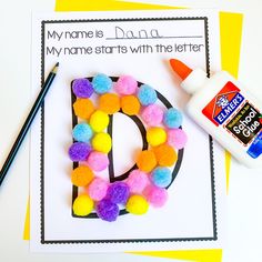 the letter d is made out of pom - poms, glue and paper