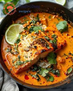 fish in a red curry sauce with cilantro and lime