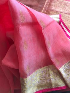 This is an eye candy!! This saree is a beautiful strawberry  pink mixed silk linen saree with lovely zari motifs in body and exquisite grand pallu woven with zari motifs. Borders are light pink base with detailed zari motifs woven in them borders are finished with thin selvages in pink on either side. Saree comes with an unstitched blouse piece  in same pink shade with zari borders as the saree. Colour may vary slightly depending upon the lighting. All sales are final. Dry clean only. Falls and Strawberry Pink, Drape Saree, Linen Saree, Pink Shade, Silk Linen, Saree Look, Pink Saree, Pink Silk, Blouse Piece