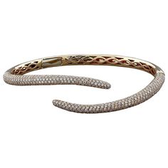 An amusing cuff with snake tails featuring 2.58 carats of VS quality round cut diamonds pave set in 18K rose gold. A sleek and stylish cuff. Fits wrists up to 7.50 inches Snake Tail, Women Diamond, Round Cut Diamond, 18k Rose Gold, Pave Diamonds, Round Diamond, Cuff Bracelet, Or Rose, Diamond Bracelet