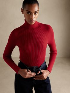 The perfect layering piece, this long-sleeved turtleneck style is crafted with a raglan shoulder seam for a subtly sporty twist.  FITTED: Stretches to fit.  Turtleneck.  Allover ribbed stitch.  Straight hem.  SUSTAINABILITY: Made with LENZING™ ECOV Classic Ribbed Long Sleeve Turtleneck, Ribbed Mock Neck Top For Workwear In Winter, Winter Ribbed Mock Neck Top For Workwear, Stretch Sweater With Ribbed Collar For Work, Stretch Turtleneck With Ribbed Cuffs, Winter Workwear Top With Ribbing, Stretch High-neck Sweater With Ribbed Cuffs, Stretch Ribbed Turtleneck Top, Ribbed Knit Turtleneck For Workwear