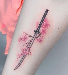 Discover the perfect sword tattoo designs that conveys strength, honor, and resilience through body art. Click here to learn more! Swords Tattoo For Women, Demon Slayer Wisteria Tattoo, Nezuko Vine Tattoo, Sakura Blossom Tattoo, Japanese Tattoo For Women, Warrior Symbol Tattoo Female, Tattoo Ideas Japanese, Tattoo Sakura, Swords Tattoo