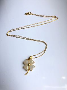 A piece of charming & cute white jade necklace, which is made with genuine 100% natural real white jades and 14k gold plated necklace. A great combination of modernness and elegance. The simple and lovely lucky clover design adds a spark to your daily wear or a bit of charm for your fun dating night. Perfect as a gift for your loved ones or yourself, and to wish them GOOD LUCK! Some Highlights of this piece 18'' white lucky Chinese jade pendants are: ＊High-quality Material Only 100% natural Handmade White Jade Necklaces, Elegant White Jade Jewelry, White Jade Jewelry For Wedding, White Flower Pendant Necklace For Anniversary, White Pendant Necklace For Good Luck, Elegant White Jewelry For Good Luck, White Jade, Jade Earrings, Jade Necklace