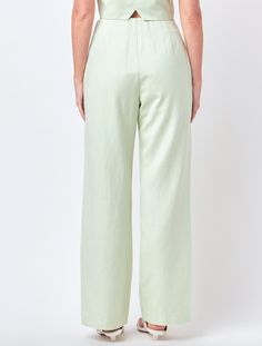 Light green pants with front zipper and slide clasp Green Cotton Wide Leg Pants With Elastic Waistband, Green Wide Leg Cotton Bottoms, Spring Green Straight Leg Pants, Green Wide Leg Bottoms, Green Wide-leg Pants For Spring, Green Cotton High-waisted Pants, Chic Green Wide-leg Bottoms, Green High-waisted Cotton Bottoms, Chic Green Wide Leg Bottoms