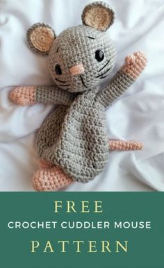 a crocheted mouse laying on top of a white sheet with the text free crochet cuddler mouse pattern