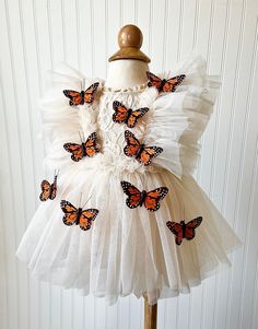 This Boho Butterfly Dress is made with a beige lace fabric. It is adorned with tulle and embellished with Monarch Butterflies. The back of the romper has an open back, giving it the perfect look. It will be enclosed with a tulle ribbon.  All of my items are made in a smoke free home and will be mailed in a box to ensure safety of the romper.   Size Chart                                                Measured in Inches                             Newborn/Preemie:     Chest - 15.5 Waist - 16 Hips Garden Party Tulle Dress With Lace Patchwork, Party Dress With Lace Work And Tulle, Lace Patchwork Dress For Dress-up, Cream Party Dress With Lace Patchwork, Cream Tulle Dresses With Ruffles, Cream Tulle Dress With Ruffles, White Tulle Dresses With Lace Patchwork, White Tulle Dress With Lace Patchwork, Cream Tulle Dresses With Lace Bodice