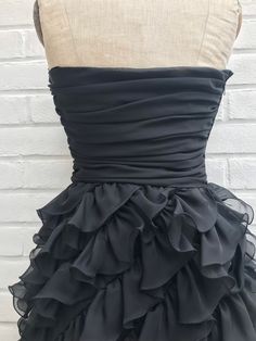 "Amazing 80s Frank Usher  little black /evening dress. Boned and ruched bodice with ruffle layered skirt . Made from a synthetic chiffon type fabric. Fully lined and lightweight.  Labelled 12 but I would say it is  smaller, please see measurements. Measured flat Chest 16\" Waist 13\"-13.5\" Pit to waist 8\" Skirt 24\" Length 33\"" Wedding Dresses Vintage 50s, Bridal Dresses Vintage, Evening Dresses Uk, Black Evening Dress, Prom Ball Gown, Abstract Dress, Lace Dress Vintage, Lace Wedding Dress Vintage, Ruched Bodice