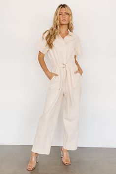 Elevate your summer style with our cream jumpsuit with short sleeves, straight pant legs, and an elastic waist for all-day comfort and effortless sophistication. Embrace timeless elegance and modern versatility with this essential piece designed to effortlessly transition from day to evening wear. White Utility Jumpsuit, Linen Jumpsuit Outfit, Nomad Clothing, Cream Jumpsuit, Jumpsuit Style, Mini Outfit, Utility Jumpsuit, Baltic Born, Jumpsuit Outfit