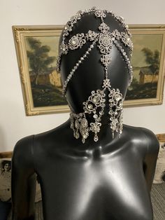 Rhinestone Silver headpiece Silver crystal Veil A silver crystal chain veil that would be perfect for weddings and festivals This gorgeous face mask is designed with clear rhinestones, and a silver chain. You will be the center of attention with these sparkling jewels at a party or to your wedding! This crystal it looks amazing under stage lights. Glamorous Crystal Headpiece With Rhinestones, Glamorous Silver Beaded Body Jewelry, Adjustable Silver Rhinestone Headpieces, Silver Bling Body Jewelry For Evening, Silver Body Jewelry With Bling For Evening, Adjustable Crystal Body Jewelry For Wedding, Silver Bling Headpiece For Party, Silver Bling Body Jewelry For Wedding, Silver Crystal Body Jewelry With Rhinestones