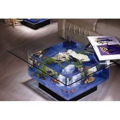 an advertisement for a coffee table with fish in it