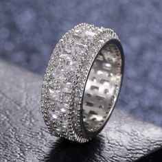 a diamond ring sitting on top of a table