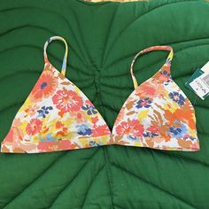 Brand New, Nwt Roxy Womens Pt Beach Classics Fixed Triangle Bikini Top. Color: Bright White Floral Escape. Pastel Peach Floral Hues. Adjustable Straps, Hook Back And Removable Padding. Spring Tropical Swimwear With Triangle Top, Tropical Triangle Top Swimwear For Spring, Multicolor Seamless Swimwear For Vacation, Pink Hawaiian Swimwear For Spring, Multicolor Seamless Swimwear For Summer, Casual Floral Print Triangle Top Swimwear, Pink Swimwear With Built-in Bra For Vacation, Spring Triangle Top Swimwear For Sunbathing, Seamless Swimwear For Vacation In Spring