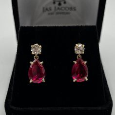 Beautiful Ruby & White Sapphire Earrings * Pear Cut Ruby measure 10mm x 7mm each * 4mm Brilliant Cut White Sapphire Accented Stud Posts * 6cts Total Gemstone Weight * Made to Order in 14k Yellow Gold, 14k White Gold, 14k Rose Gold or Sterling Silver Hallmarked & Gift Ready!          Matching Pendant Necklace & Ring also Available!  These Ruby are Laboratory Grown. They are identical to the Natural Stone in every way including Chemistry, Composition and Hardness with excellent clarity & color refraction. TIMELESS, BEAUTIFUL & UNIQUE FINE ART JEWELRY Luxury Pearl Drop Ruby Jewelry, Ruby Earrings Silver, White Sapphire Earrings, Pretty Accessories, White Sapphire Ring, Fine Art Jewelry, Necklace Ring, Ruby Earrings, Drop Dangle Earrings