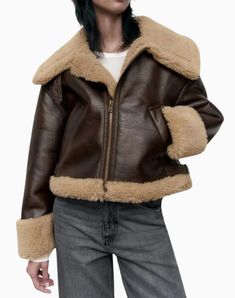 Material : Made from high-quality faux shearling and leather for a stylish and warm look. Design : Classic A-2 bomber style with a sleek brown finish that complements various outfits. Comfort : Soft faux shearling lining provides warmth and comfort during colder months. Versatility : Suitable for casual and semi-formal occasions, easily paired with jeans, skirts, or dresses. Details : Features ribbed cuffs and hem for a snug fit, along with a zippered front for easy wear. Brown Sheepskin Outerwear With Faux Fur Trim, Winter Brown Leather Jacket With Padded Collar, Brown Leather Jacket With Padded Collar For Winter, Brown Sheepskin Outerwear With Faux Fur Lining, Fall Shearling Fur Coat With Padded Collar, Brown Shearling Outerwear For Fall, Brown Leather Jacket With Faux Fur Trim For Winter, Fall Brown Biker Jacket With Padded Collar, Winter Brown Shearling Outerwear