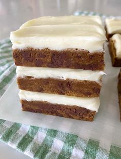 slices of cake sitting on top of a green and white checkered cloth