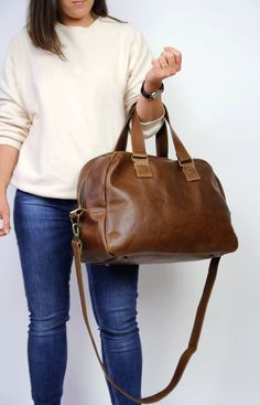 Brown Large Bag, Duffel Bag, Leather Travel Bag Dimensions: height: 30 cm (12 in) width at the base: 47 cm (18.5 in) width at the top: 39 cm (15.5 in) depth: 17 cm (6.7 inch) handle strap drop: 19 cm (7.5 inch) long strap: 122 cm (48 inch) This Unisex bag is perfect as a travel bag, for a stylish weekend, overnight bag or gym bag. Beautiful vegetable tanned leather makes this bag an unique gift for your beloved one. The bag is made from top quality leather. Thanks to solid brass hardware and lea Large Capacity Duffle Bag Satchel For Daily Use, Large Capacity Duffle Bag For Daily Use, Everyday Satchel Travel Bag With Adjustable Handle, On-the-go Travel Bag Satchel With Adjustable Handle, Everyday Large Capacity Satchel Duffle Bag, Everyday Satchel Duffle Bag, Weekender Satchel Bag With Adjustable Handle For On-the-go, Travel Shoulder Bag With Adjustable Handle, Everyday Travel Shoulder Bag With Adjustable Handle