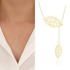 "Introducing the 14K Double Leaves Gold Necklace; A gorgeous and unique piece of jewelry, the Golden Double Leaves Necklace will add elegance to any look. Two golden leaves that softly dangle from a delicate chain are the focal point of this necklace, which was expertly crafted from premium materials. It is the ideal pick for special occasions or to add a touch of sparkle to your everyday outfit because of the wonderful detailing and attractive design. This necklace is sure to become an iconic a Yellow Gold Plated Leaf-shaped Jewelry, Leaf-shaped Yellow Gold Plated Jewelry, Yellow Gold Leaf-shaped Jewelry For Anniversary, Yellow Gold Leaf-shaped Anniversary Jewelry, Anniversary Yellow Gold Leaf Jewelry, Leaf-shaped Yellow Gold Jewelry For Weddings, Leaf-shaped Yellow Gold Wedding Jewelry, Yellow Gold Leaf-shaped Jewelry Gift, Elegant Rose Gold Leaf Jewelry