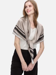 The Silk Duo Wrap is the ultimate versatile piece for breezy layering. Made from 100% silk, it effortlessly transitions from a chic wrap to an elegant scarf. Its oversized cut and minimal hem detail offer a relaxed feel, combining comfort and style seamlessly. 100% Silk: Crafted from 16 momme silk, it boasts a smooth, pearl-like gloss that drapes beautifully. All-Season Comfort: Breathable, hypoallergenic, and moisture-retaining, it's perfect for sensitive skin. Versatile Elegance: The 2-in-1 de Chic Beige Silk Scarf, Chic Spring Wrap Shawl, Chic Beige Silk Scarf For Spring, Elegant Wrap Shawl For Layering, Elegant Beige Scarves For Workwear, Chic Beige Shawl For Spring, Chic Silk Shawl Scarf, Elegant Shawl For Layering, Chic Solid Color Silk Scarf