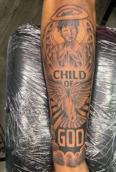 a man's arm with an angel and the words child of god on it