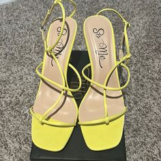 Low Heel Lime/Yellow Heels One Strap Around Toe Other Around Foot N Last Strap Goes Around Ankle Yellow Sandals With Padded Heel And Pointed Toe, Yellow Pointed Toe Sandals With Padded Heel, Yellow Heels With Heel Strap For Summer, Yellow Heels With 4-inch Heel For Spring, Spring Yellow Heels With 4-inch Heel, Yellow Summer Evening Heels, Yellow Heels With Padded Block Heel, Yellow Block Heels With Padded Heel, Yellow Open Toe Heels With 4-inch Heel