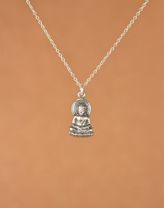 Buddha necklace, silver buddha necklace, yoga necklace, gautama, protection necklace, a sterling silver buddha on a sterling silver chain A peaceful, little, solid silver buddha god hangs from a sterling silver chain in the length of your choice. This buddha is also available in matte or shiny gold vermeil on a 14k gold filled chain. The pendant measures 12mm x 8mm. ♥ Handmade with love in sunny California ♥ This gem will arrive happily in a gift pouch or box Looking for other charm necklaces? h Silver Round Pendant Necklace For Meditation, Nickel-free Silver Charm Necklaces For Meditation, Sterling Silver Necklace For Meditation, Sterling Silver Pendant Necklace For Meditation, Handmade Silver Necklaces For Meditation, Silver Amulet Charm Necklace For Meditation, Silver Pendant Necklace For Meditation, Sterling Silver Pendant Charm Necklace For Meditation, Symbolic Sterling Silver Necklace For Meditation