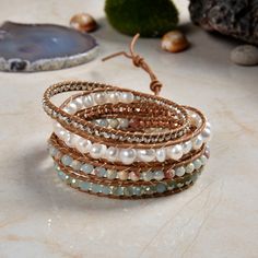 "Hand beaded and stitched on genuine leather. This unique wrap bracelet is designed to wrap around the wrist up to five times. Three adjustable closures measure approx. 33\", 34\", 35\" Exquisite workmanship! Material: Semi-baroque cultured freshwater pearls, blue jasper, and iridescent crystals. Clasp: SIlver tone toggle clasp. https://www.etsy.com/shop/MYGEMSROCK" Adjustable Hand Wrapped Leather Wrap Bracelet, Bohemian Beaded Leather Wrap Bracelet, Bohemian Hand Wrapped Leather Wrap Bracelet, Wrap Armband, Blue Jasper, Iridescent Crystal, Statement Bracelet, Freshwater Cultured Pearls, Rose Quartz Crystal