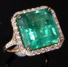 LAYAWAY PLANS AVAILABLE PLEASE CONTACT US FOR DETAILS  Style: You are looking at a custom made stunning  Emerald and Diamonds cocktail ring.  The ring features a beautiful  5.6ct step  cut Green Colombian Emerald surrounded by  .81ct  of VS clarity Diamonds.   The setting is 18K solid yellow gold.  Size of the ring is impressive with front measuring  approximately 1.4cm x 1.4cm.  This ring can make an amazing engagement ring fit for royalty or just be a stunning cocktail piece.  Please note, thi Columbian Emeralds, Best Engagement Rings, White Gold Wedding Rings, Colombian Emeralds, Diamond Cocktail Rings, Emerald Engagement, I Love Jewelry, Emerald Jewelry, Emerald Ring