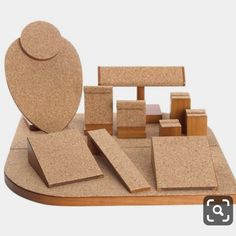 a wooden block set with cork blocks and a circular object on it's surface