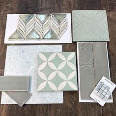 several different types of tile laid out on a wooden floor with various shapes and sizes