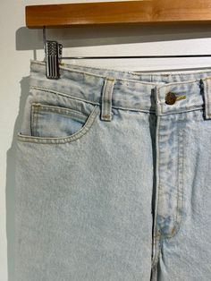 Vintage Georges Marciano for Guess Light Wash Jeans. High-waisted cut with legs that taper. Zippered slits at each ankle. In excellent vintage condition. Marked size 30 (but see measurements). Made in the USA. 100% cotton, machine wash warm. Approx. Measurements: Waist: 29" Length: 37.5" Inseam: 26" Rise: 12" Retro Wide-leg Bottoms With Frayed Hem, Retro Wide Leg Bottoms With Frayed Hem, Classic Light Wash Cropped Pants, Classic Light Wash Cropped Leg Bottoms, Classic Light Wash Cropped Bottoms, Classic Light Wash Tapered Leg Bottoms, Classic Tapered Leg Light Wash Bottoms, Classic High Rise Bottoms With Frayed Hem, Classic Light Wash Bottoms For Spring