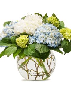 a vase filled with blue and white flowers