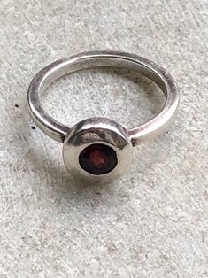 Modernist Sterling Silver Garnet Vintage Ring Garnet is the Birth Stone for January Garnet is a spiritual stone of higher thinking and self-empowerment, it is also a stone of strength and safety. ... It is a stone of prosperity and abundance, encouraging gratitude and service to others. Associated with the Base, Sacral, Solar Plexus and Heart Chakras, Grossular Garnet is a deeply spiritual stone. Ring size 8 1/2 Garnet Vintage Ring, Service To Others, Grossular Garnet, Garnet Ring Vintage, Prosperity And Abundance, Usa Jewelry, Solar Plexus, Handcrafted Necklace, Garnet Rings