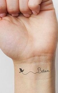 a woman's arm with a small tattoo on the wrist that says, believe