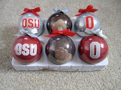 six ornaments with the word osu on them are in an egg carton for display