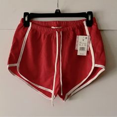 Pull On Shorts With Drawstring / Color Is More Coral Than Red / 2.25” Inseam / 72% Cotton 28% Polyester Small: Waist Side To Side 13”, Stretches To 20” Hips At Widest, Side To Side 17.5” Inseam 2.5” Medium: Waist Side To Side 14”, Stretches To 20.75” Hips At Widest, Side To Side 19.5” Inseam 2.5” Red Stretch Athletic Shorts For Spring, Red Drawstring Bottoms For Spring, Red Workout Shorts For Spring, Red Athleisure Shorts For Spring, Red Workout Bottoms For Spring, Red Athletic Shorts For Spring, Red Summer Sports Bottoms, Red Drawstring Bottoms For Summer, Red Stretch Summer Shorts