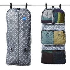 an over - the - door hanging garment bag with multiple pockets and clothes in it