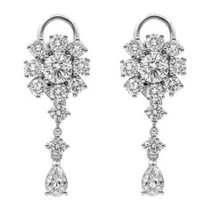 Each elegant and brilliant dangle earring showcases two GIA certified round brilliant diamond weighing 1.54 carats total, D-E color and SI1 in clarity, surrounded by brilliant round melee diamonds set in a halo. Brilliant Round and pear shape diamonds are elegantly drop from the diamond halo weighing 5.96 carats total, E-F color and VS in clarity respectively. Perfectly made in platinum. Roman Malakov is a custom house, specializing in creating anything you can imagine. If you would like to rece Pear Cut Diamond, Pear Shaped Diamond, Antique Earrings, Fantasy Jewelry, Gia Certified Diamonds, Diamond Cluster, Brilliant Diamond, Pear Cut, Halo Diamond