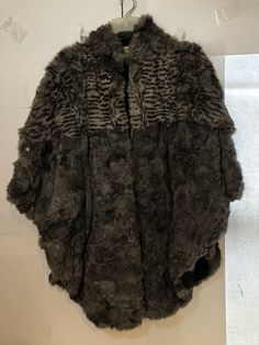 Vtg Bermans Rabbit Fur Cape Poncho Jacket Coat, One Size Flaw. Pit to pit about 38”. Shoulder to base about 35”. On of the fasteners came un sewn a little bit and it’s loose. Has a hole on the back There looks to be a patches of fur missing. Some furs are shedding off still. Selling as is no returns. Shipped with USPS Priority Mail. 6e Opposite Aesthetic, Archive Pieces, Disco Fashion, Poncho Jacket, Fur Cape, Clothes Diy, Poncho Cape, Rabbit Fur, Jacket Coat