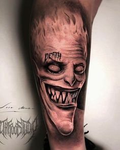 a man's leg with a scary mask on it