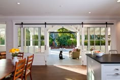 an open door leading to a living room and dining area