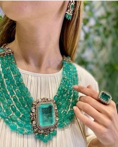 Presenting an exquisite Sabyasachi inspired fine quality layered necklace set, meticulously crafted to evoke timeless elegance and sophistication. This stunning set features an opulent array of emerald green faux zirconium, flawlessly integrated with Polki Kundan work to create a regal masterpiece. Each layer of the necklace is thoughtfully designed, with intricate detailing that captures the essence of traditional Indian jewelry while embracing contemporary aesthetics. The emerald green hue of Elegant Chandbali Necklaces With Jewels, Elegant Meenakari Jewelry Sets For Reception, Opulent Festive Party Jewelry, Festive Elegant Kundan Necklace With Jewels, Elegant Festive Kundan Necklace With Jewels, Festive Elegant Kundan Necklace, Opulent Formal Festive Jewelry, Opulent Festive Formal Jewelry, Elegant Meenakari Jewelry Sets