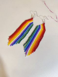 Beautiful multicolored bohemian style earrings with a rainbow of Czech beads Length 4.3 inches (11.5cm) Width 1 inch (2.5cm) Hypoallergenic clasp Bohemian Rainbow Jewelry, Bohemian Rainbow Jewelry With Ear Wire, Bohemian Rainbow Beaded Earrings For Summer, Bohemian Rainbow Beaded Earrings With Ear Wire, Rainbow Beaded Earrings With Ear Wire, Summer Rainbow Beaded Earrings With Dangling Beads, Bohemian Rainbow Beaded Jewelry, Rainbow Beaded Dangle Earrings For Summer, Handmade Rainbow Earrings For Summer