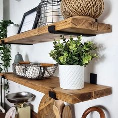 some shelves with plants and cutting boards on them