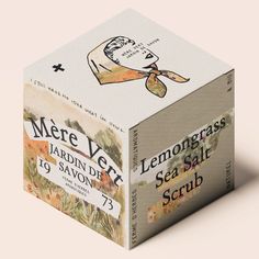 the lemongrass sea salt scrub box is shown in front of a white background with an image of a woman's hat on it