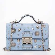 Order this light blue studded bag today with free shipping and returns. This sky blue crossbody is stylish with it's unique silver appliqués metals and silver hardware. It can be worn over the shoulder, by the handle, or as a crossbody. Blue Leather Bag, Hollywood Lights, Serenity Blue, Small Leather Bag, Studded Bag, Blue Purse, Stylish Baby, Bag Light, Studded Leather