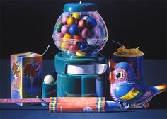 an image of a gummy machine with balls in it and other items around it