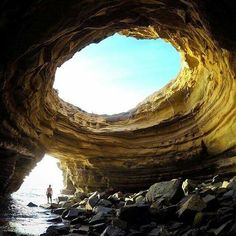 an image of the inside of a cave with people in it on instagrams