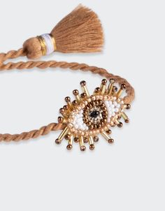 Hand beaded beige Mini Eye Bracelet. Composition: Seed beads, purl wire, leather backing and cotton thread SKU: 2462-0067 Kids Pillows Bed, Hand Embroidered Jewelry, Amulet Bracelet, Indian Crafts, Embroidered Clothes, Eye Bracelet, Evil Eye Bracelet, Women Artisans, Upcycled Vintage